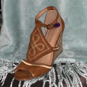 Brown suede wedge heels with stitched pattern